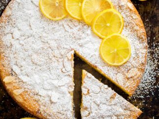 Almond cake recipe with lemon and a slice removed