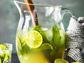 a pitcher of mojitos on a table