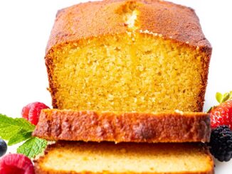 slices of almond flour pound cake in front of the loaf